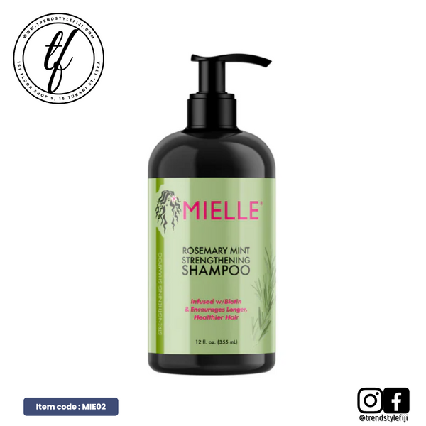A bottle of Mielle Rosemary Mint Strengthening Shampoo with a pump dispenser. The label includes the product name and an indication that it is infused with biotin and made with organic ingredients.